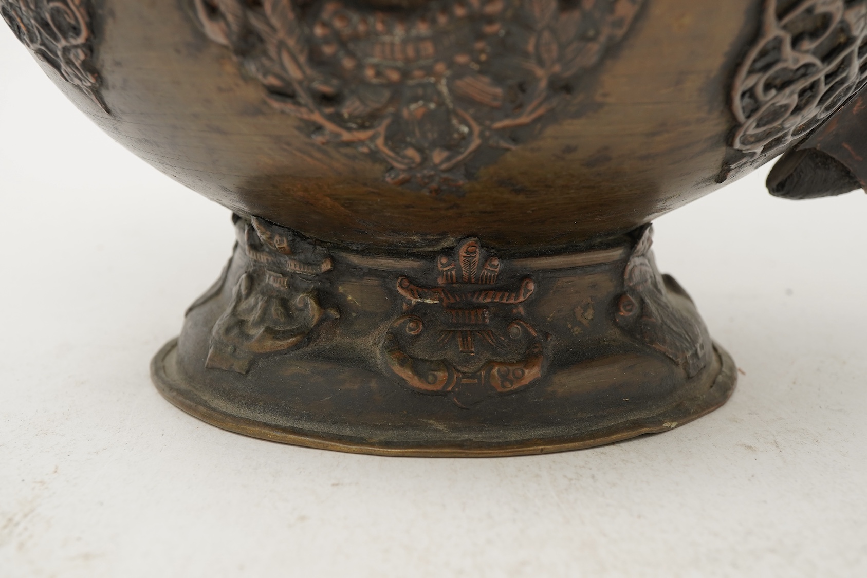 A large Tibetan repoussé brass and copper ewer, 19th century